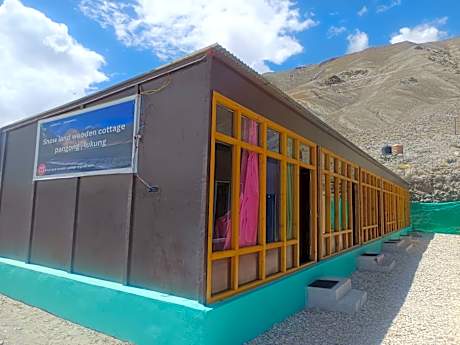 snow land wooden cottage