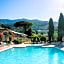 Hotel with swimming pool surrounded by greenery in San Donato Fronzano, rooms with air conditioning and breakfast included