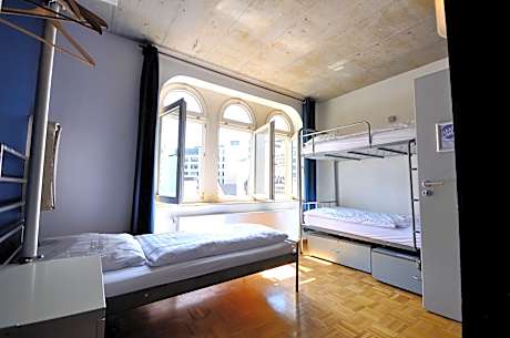 Single Bed in Mixed Dormitory Room (3 Adults) with Bathroom