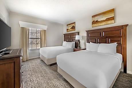 Two-Bedroom Deluxe Suite with One King Bed, Two Double Beds and Golf View