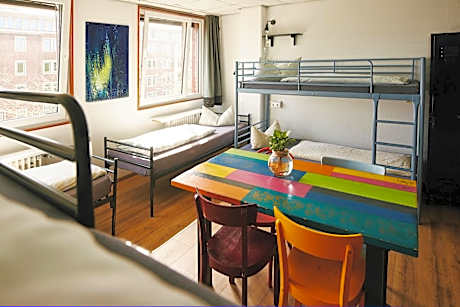 Bed in 8-Bed Dormitory Room with Shared Bathroom