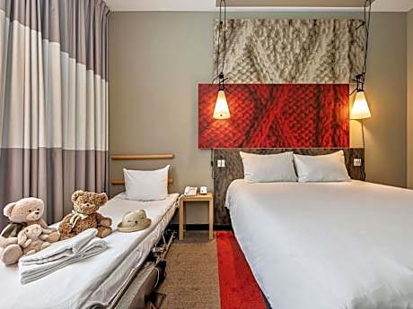 Room with one Queen bed and sofa