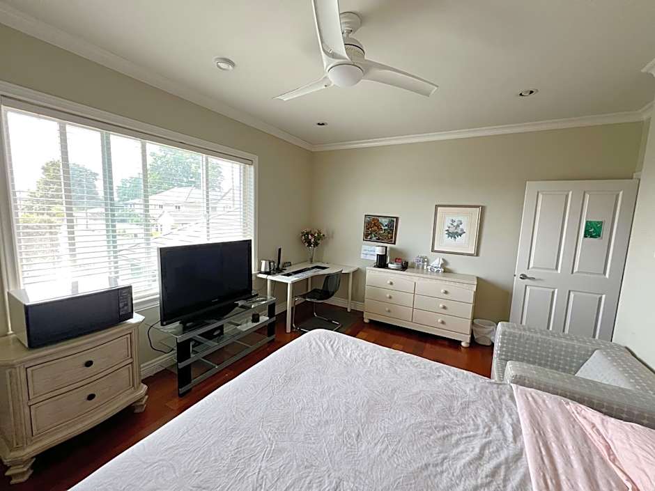 A cozy bedroom with a private washroom close to YVR Richmond
