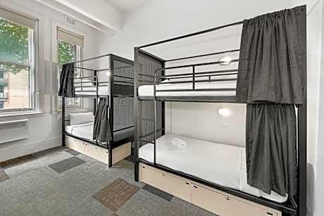 Bed in 8-Bed Male Dormitory Room with Shared Bathroom