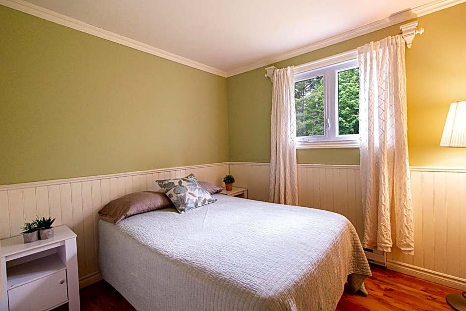 Tranquil Riverfront Chalet with Hot Tub