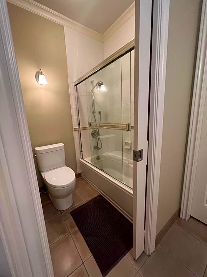 A cozy bedroom with a private washroom close to YVR Richmond