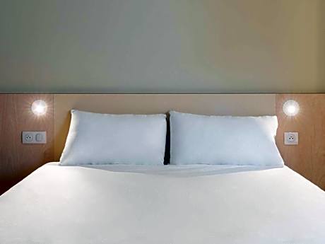 Room with One Queen Bed and One Bunk Bed