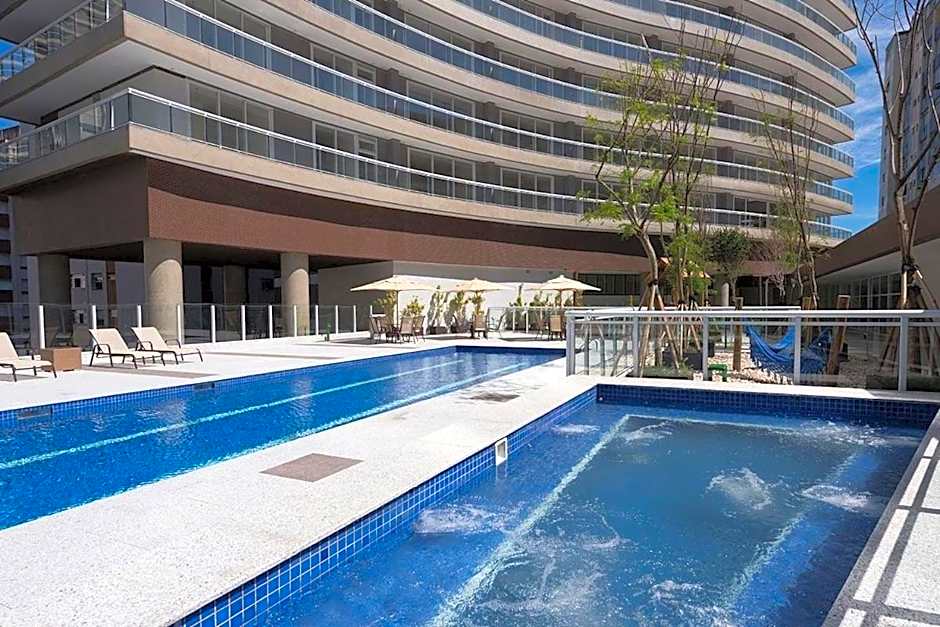 Studio moderno em condomínio de luxo pé na areia
