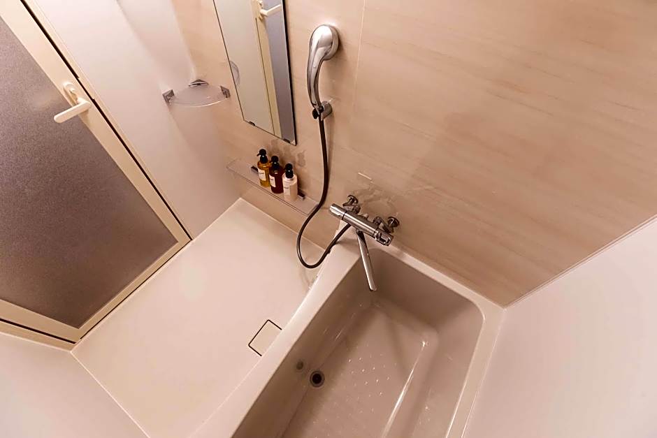 Mr.KINJO in front of Manza Beach