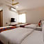FabHotel Dhanvitha Suites