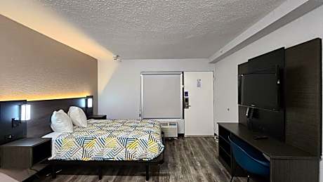 One King Bed Smoking Room With Free Wi-Fi, Refrigerator, Microwave And Desk
