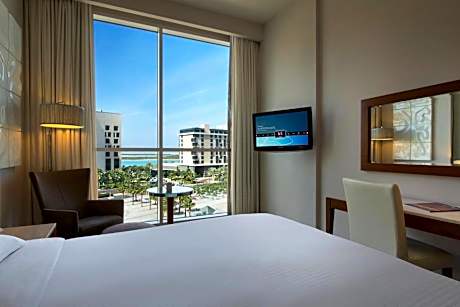 Premium Family Room with One Queen Bed, Two Twin Beds and Plaza View