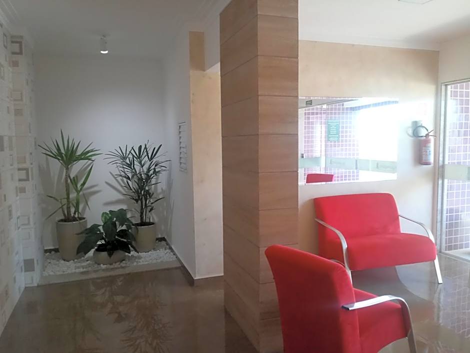 Prédio com piscina na cobertura frente ao mar, apartamento para até 6 pessoas e 3 crianças até 8 anos, churrasqueira na sacada, Wi-Fi grátis, NÃO oferecemos roupas de cama e banho, 1 vaga de garagem, na Praia Grande-Vila Mirim