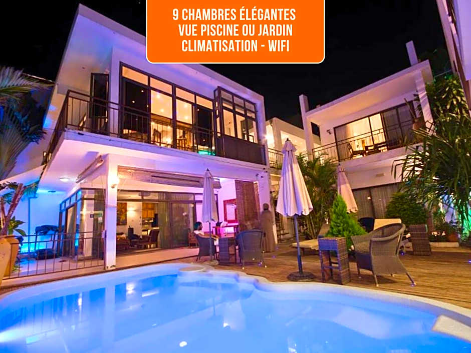 Villa Alizée - Boutique Hôtel Expérience - Idéal Couples & Pros - Piscine - Restaurant - Rooftop bar - Parking privé - 10min Port-Louis - Ambiance Tropical chic & authentique