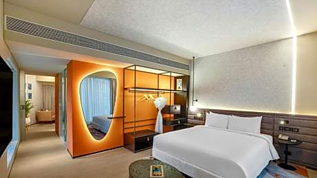 Premier Suite with Complimentary IMFL from 6:00 pm to 8 pm at Barcode and Two Way Airport Transfer