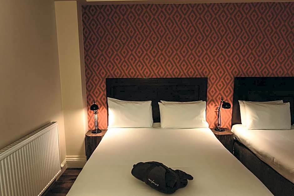 Photo 1 sur 4 de Triple Room