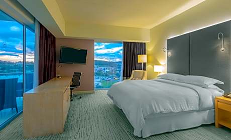 Larger Deluxe King Room with One King Bed and Balcony - Mountain View/Club Access/Rain Shower