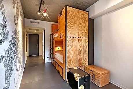 Bed in double room with shared bathroom