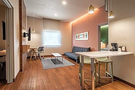 Two-Bedroom Suite with One King and Two Double Beds with Sofa Bed and Kitchenette