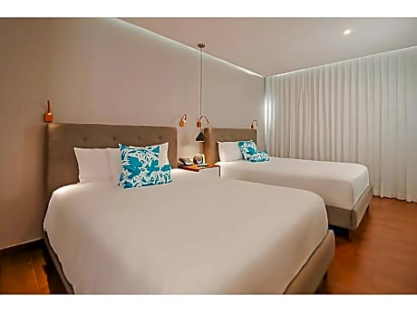 Deluxe Room with Tow Double Beds - Courtyard View
