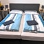 BUSINESS-MOTEL free WiFi & massage, air-con, XXL-Parking