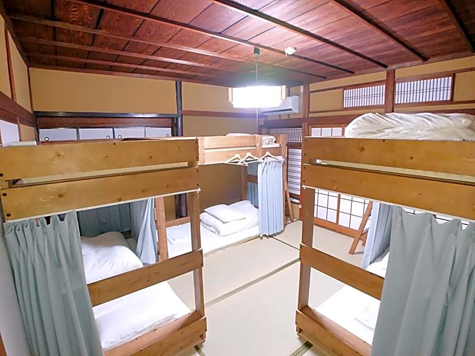 Photo 1 of 1 of Economy Triple Room with Shared Bathroom