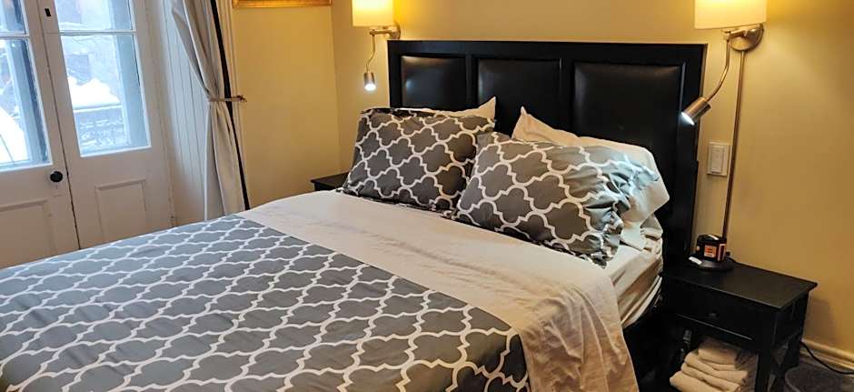 Photo 1 of 8 of Queen Room with Shared Bathroom