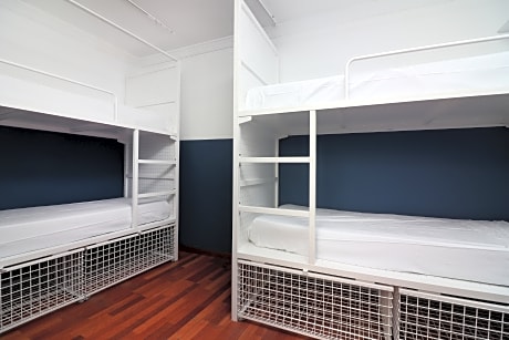 Bed In Dormitory With Shared Bathroom