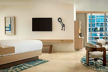 Executive suite with king bed, balcony and partial ocean view