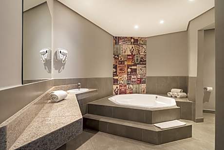 Family suite with 1 double size bed and 2 single beds