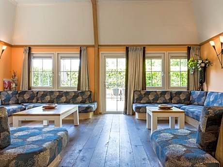 Designed home with bedstead, surrounded by forest