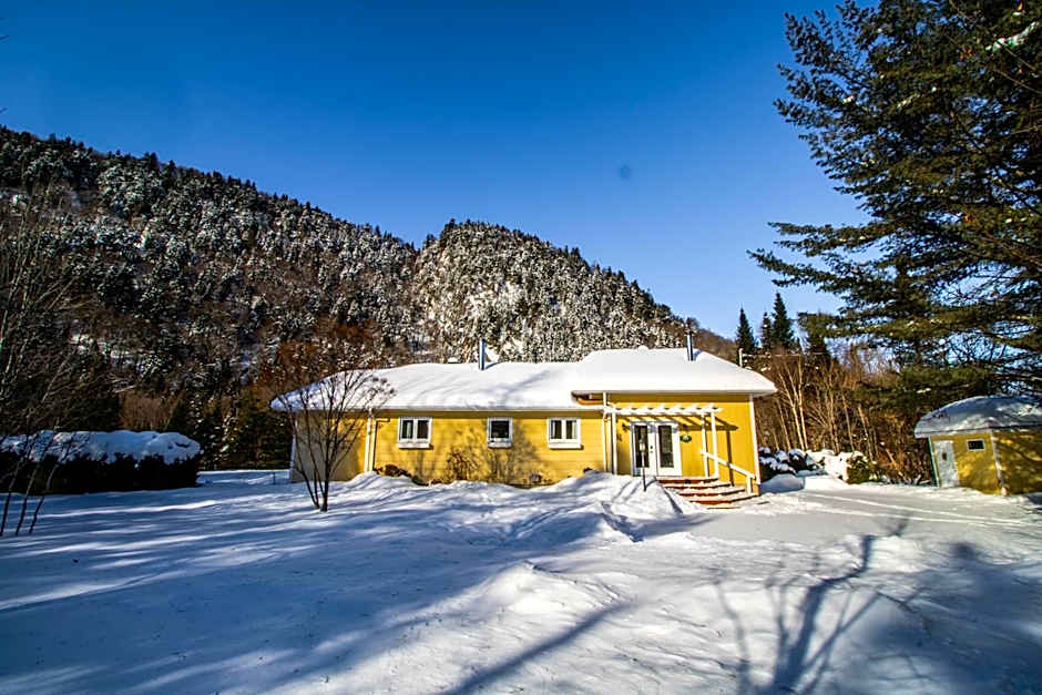 Tranquil Riverfront Chalet with Hot Tub