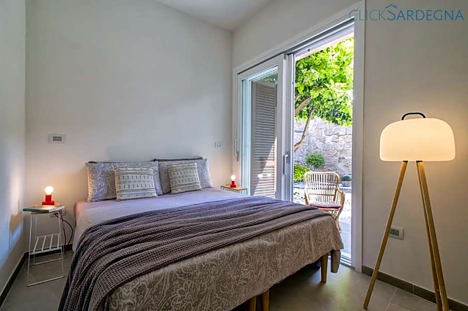 ClickSardinia Alghero Spectacular waterfront Neptune apartment with sea-facing terraces and garden