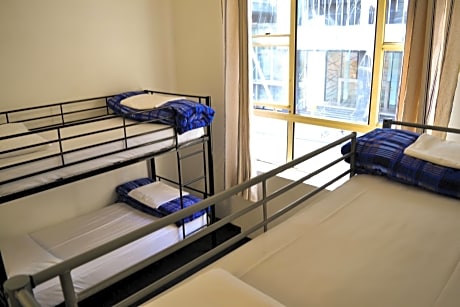 Bed in 4-Bed Female Dormitory Room with Shared Bathroom