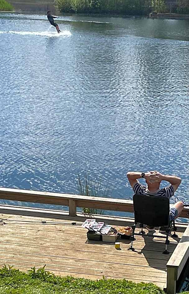 Award winning Serenity Lodge with outstanding lakeside views from the hot tub , at Tallington Lakes Leisure Park, Stamford