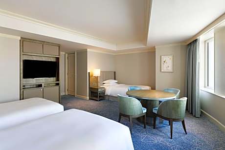 Family Room with Three Twin Beds and Partial City View