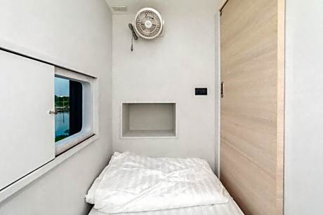 Single Bed in Dormitory Room