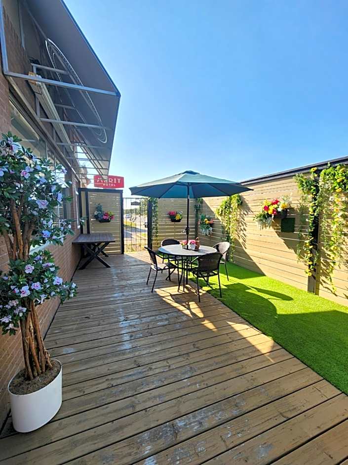 Merit Hotel & Suites