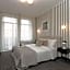 Happy Inn Rooms & Suites