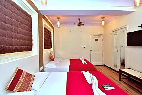 Family Room with fan (4 Adults) - 10% off on SURA Cocktails & Cuisines, Enjoy Live Music, Welcome Drink on Arrival and Free Pickup from Railway Station