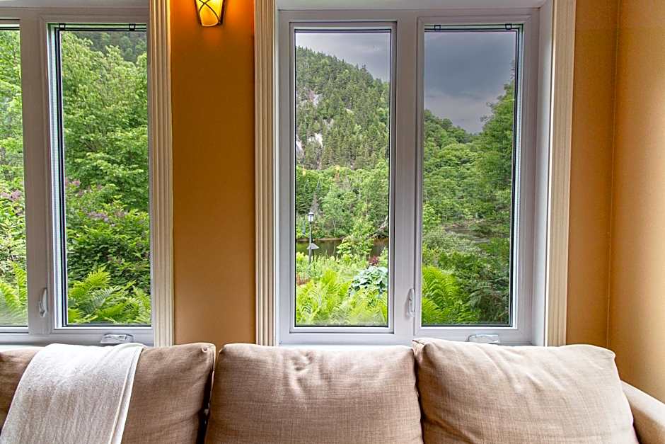 Tranquil Riverfront Chalet with Hot Tub