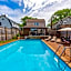 vacation house with a heated pool and hot tub