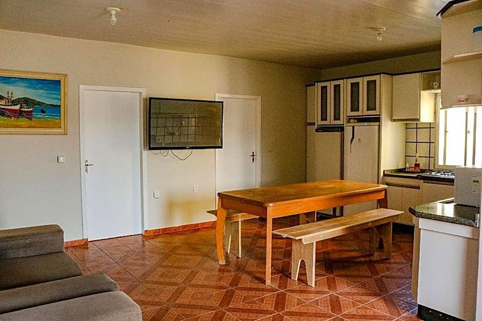 Casa pé na areia com vista especial do pôr do sol.