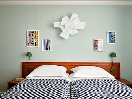 Twin Room with Balcony and Courtyard View (2 Adults + 1 Child )