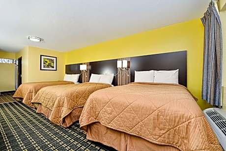 Comfortable Guest Room With 3 Double Beds And A Kitchenette. Smoking Permitted.