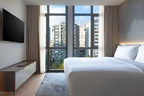 Three-Bedroom Apartment with Balcony and City View