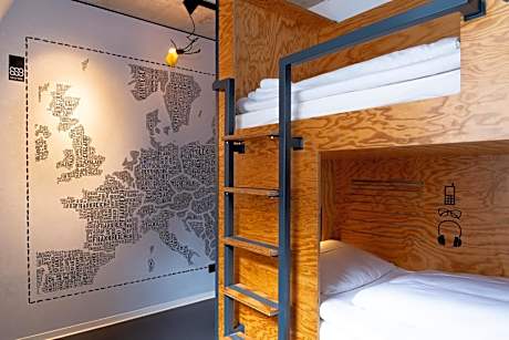 Bed in double room with shared bathroom