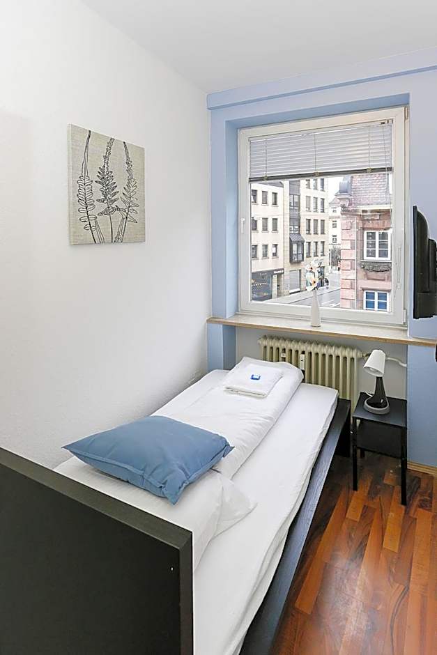 Zentral gelegene Zimmer mit Gemeinschaftsbad und Küche