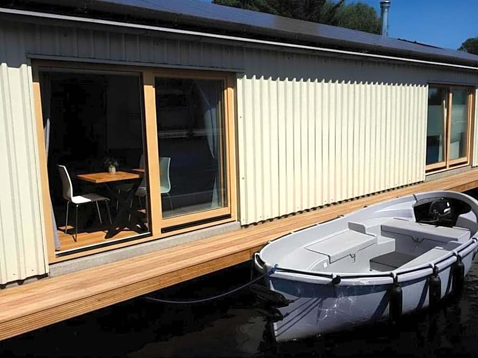 B&Boathouse Amsterdam with bikes and motorboat