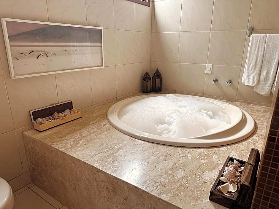 Casa Ilha| beira mar, piscina aquecida, 4 suítes